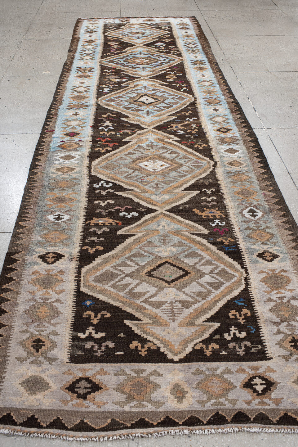 4' x 14' one-of-a-kind handmade antique Kilim runner rug. Color palette: brown, sky blue, taupe, ivory, camel, charcoal