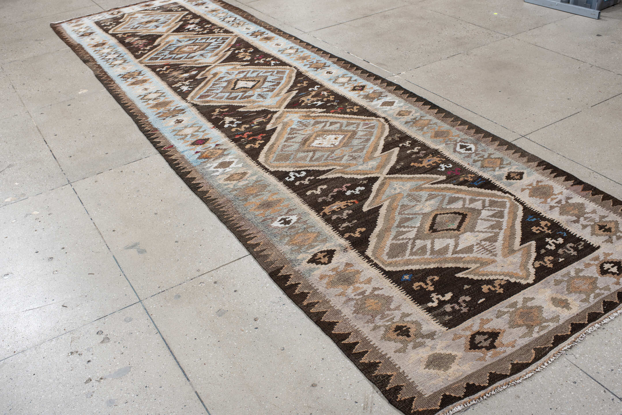 4' x 14' one-of-a-kind handmade antique Kilim runner rug. Color palette: brown, sky blue, taupe, ivory, camel, charcoal