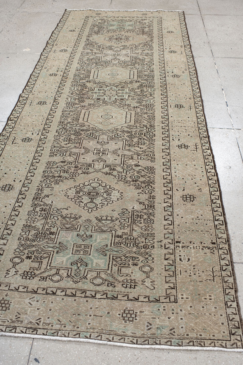 4' x 10' one-of-a-kind handmade vintage Karaje runner rug. Color palette: ivory, taupe, brown, camel, sage, charcoal, beige