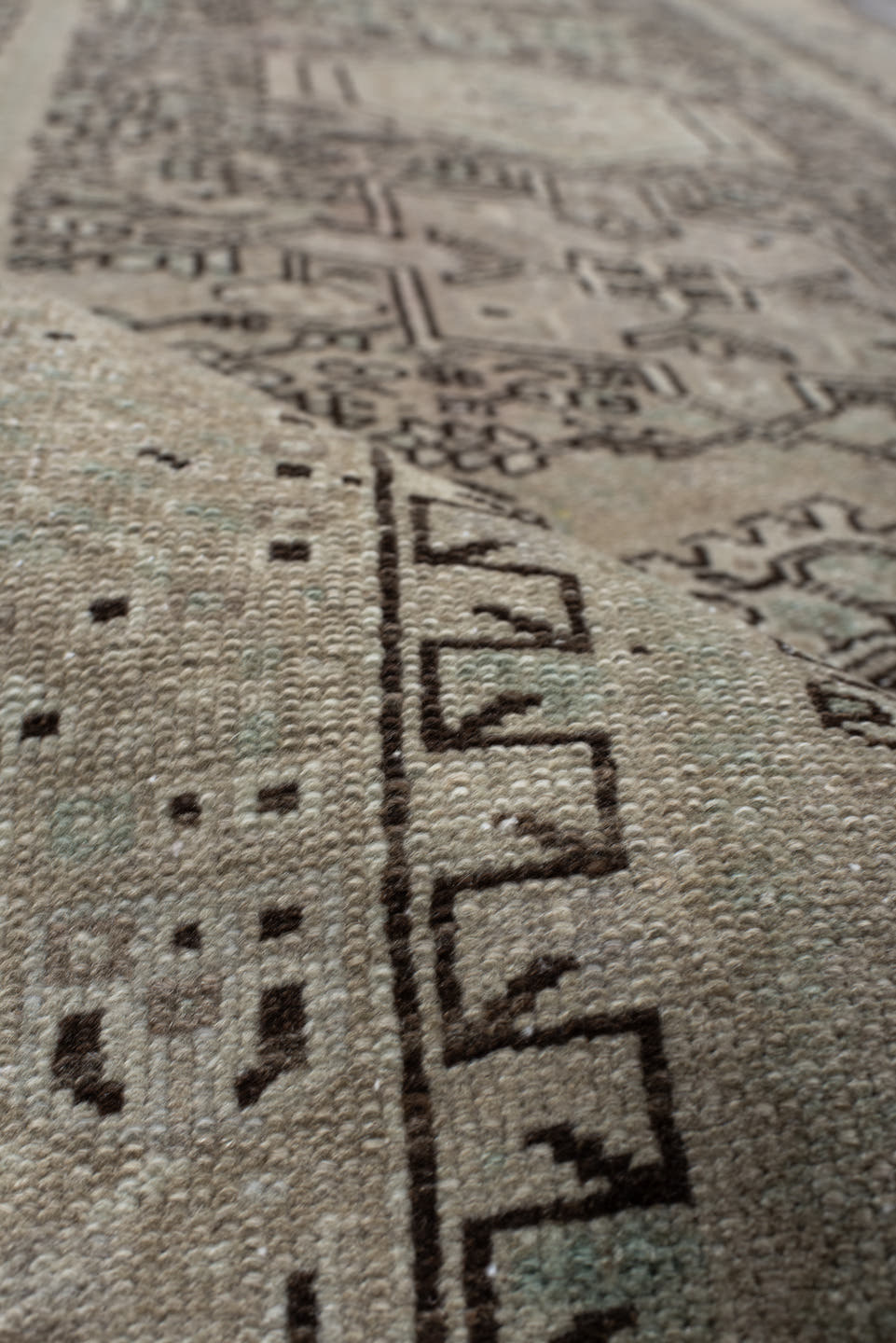4' x 10' one-of-a-kind handmade vintage Karaje runner rug. Color palette: ivory, taupe, brown, camel, sage, charcoal, beige