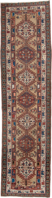 3' x 13' one-of-a-kind handmade vintage Sarab runner rug. Color palette: ivory, rust, indigo, teal, camel, crimson, brown