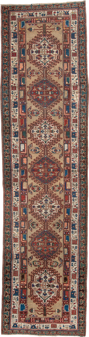 3' x 13' one-of-a-kind handmade vintage Sarab runner rug. Color palette: ivory, rust, indigo, teal, camel, crimson, brown