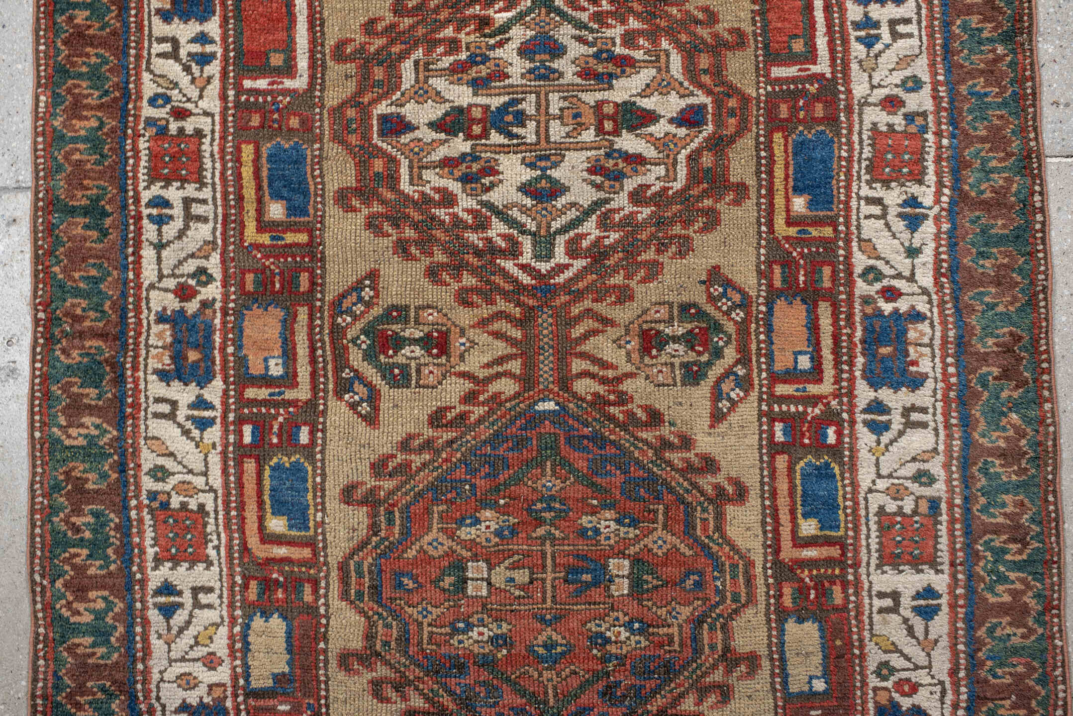 3' x 13' one-of-a-kind handmade vintage Sarab runner rug. Color palette: ivory, rust, indigo, teal, camel, crimson, brown
