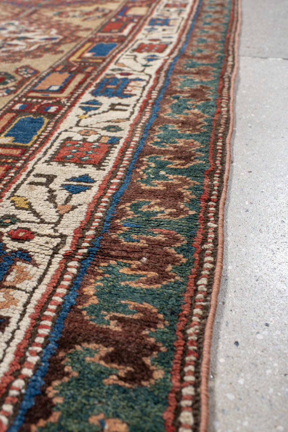 3' x 13' one-of-a-kind handmade vintage Sarab runner rug. Color palette: ivory, rust, indigo, teal, camel, crimson, brown