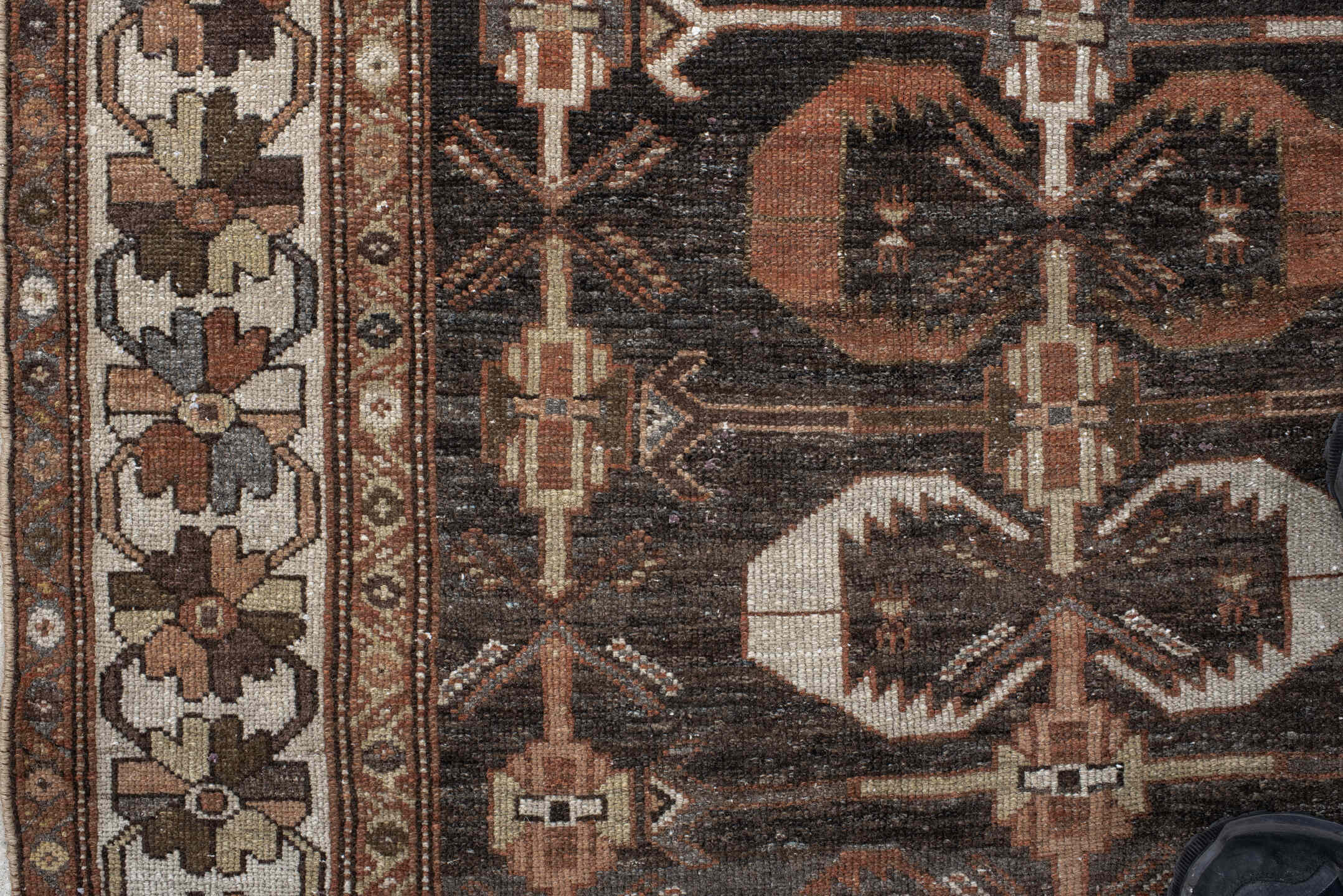 4' x 7' one-of-a-kind handmade antique Shirvan rug. Color palette: charcoal, ivory, rust, taupe, slate, camel, terracotta