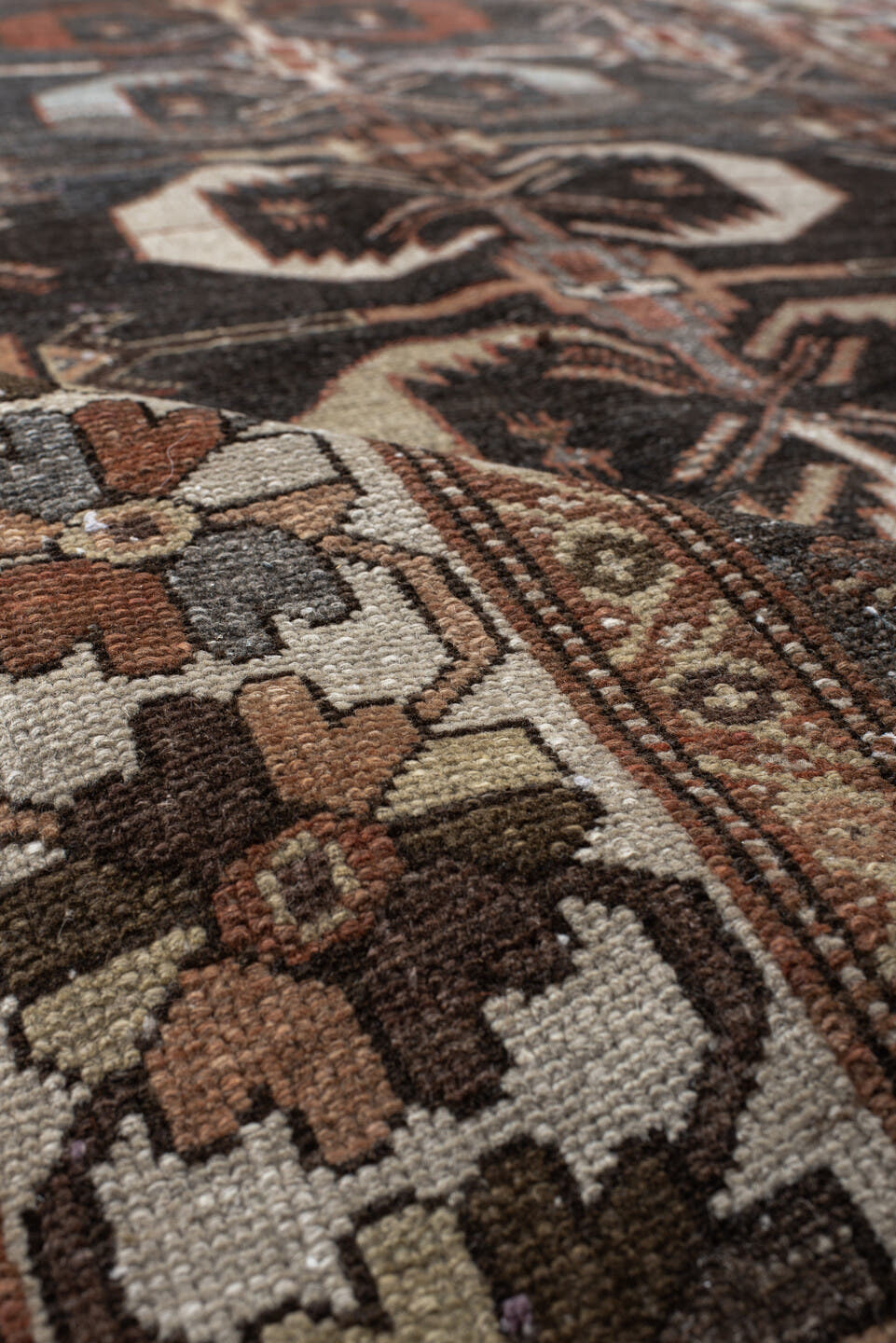 4' x 7' one-of-a-kind handmade antique Shirvan rug. Color palette: charcoal, ivory, rust, taupe, slate, camel, terracotta