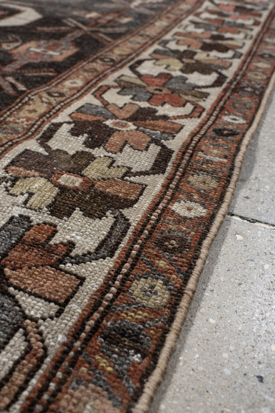 4' x 7' one-of-a-kind handmade antique Shirvan rug. Color palette: charcoal, ivory, rust, taupe, slate, camel, terracotta