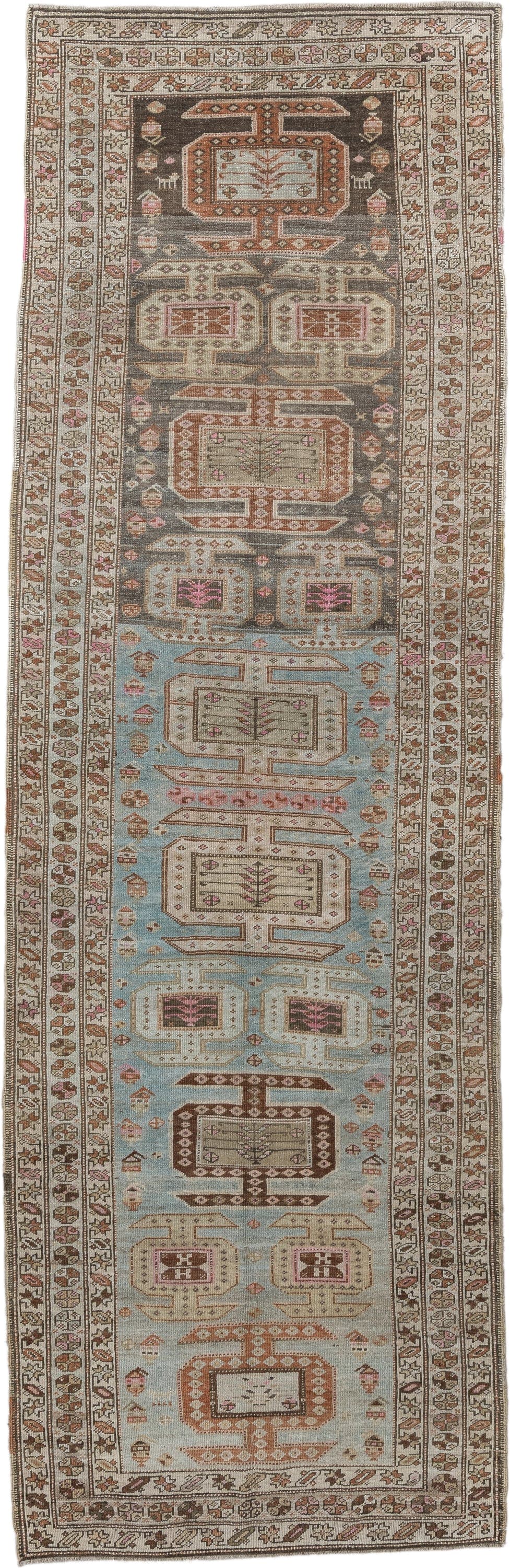 3' x 11' one-of-a-kind handmade vintage runner rug. Color palette: ivory, sky blue, brown, rust, taupe, rose, charcoal