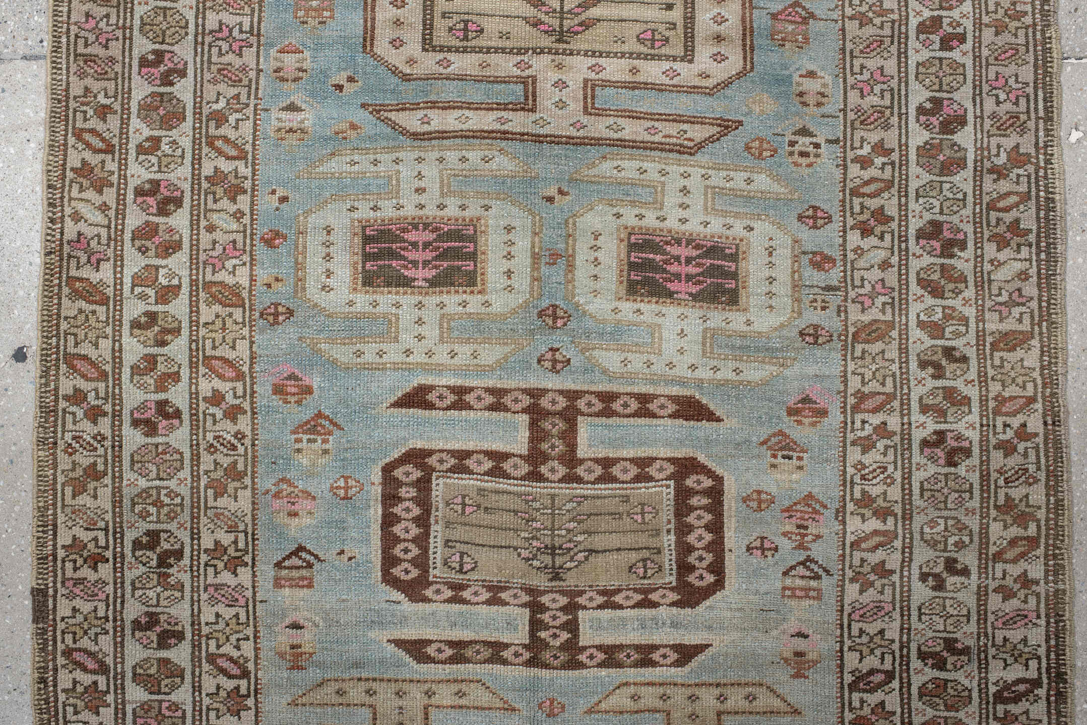 3' x 11' one-of-a-kind handmade vintage runner rug. Color palette: ivory, sky blue, brown, rust, taupe, rose, charcoal