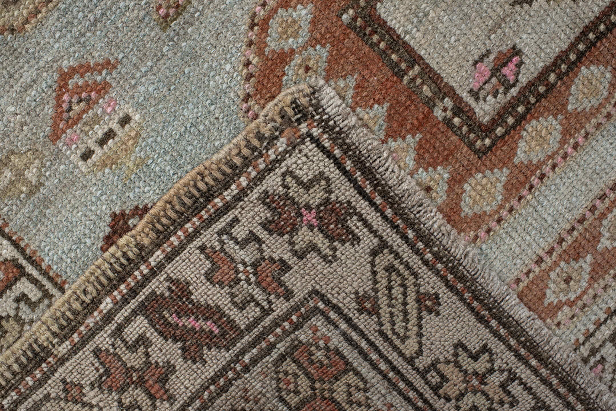 3' x 11' one-of-a-kind handmade vintage runner rug. Color palette: ivory, sky blue, brown, rust, taupe, rose, charcoal