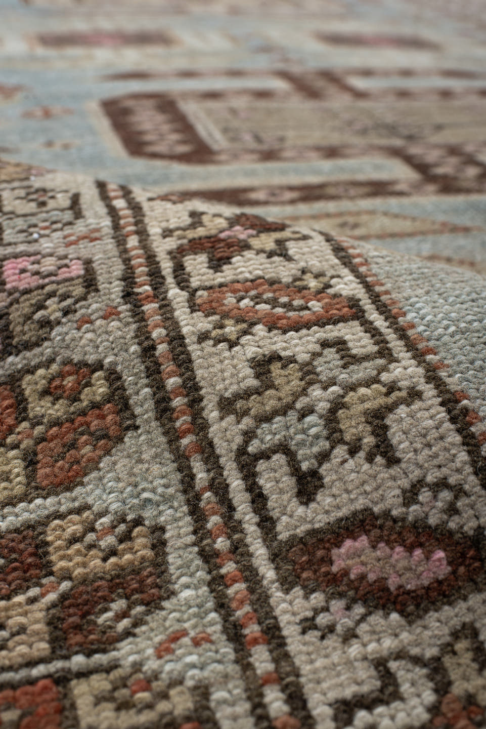 3' x 11' one-of-a-kind handmade vintage runner rug. Color palette: ivory, sky blue, brown, rust, taupe, rose, charcoal