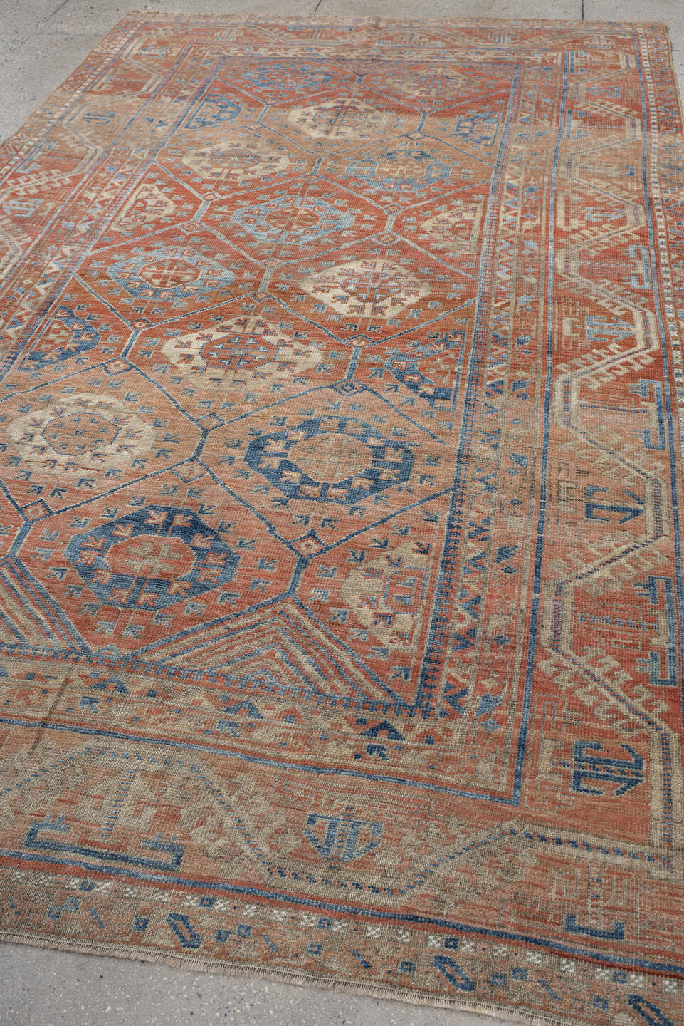 6' x 10' one-of-a-kind handmade antique Belouch large size rug. Color palette: rust, ivory, blue, terra cotta, camel, slate