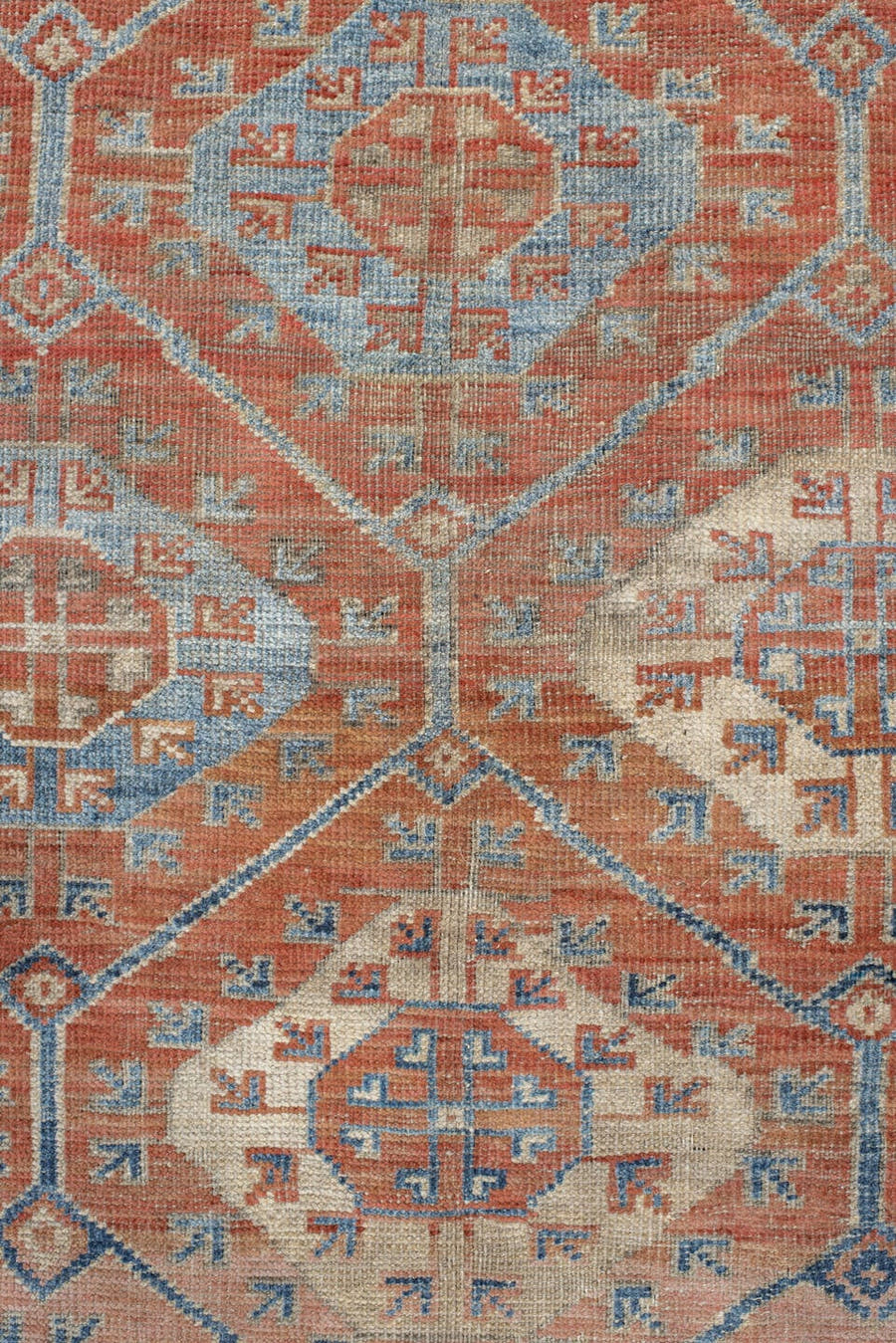 6' x 10' one-of-a-kind handmade antique Belouch large size rug. Color palette: rust, ivory, blue, terra cotta, camel, slate