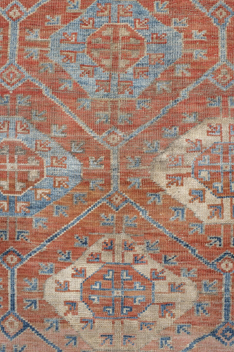 6' x 10' one-of-a-kind handmade antique Belouch large size rug. Color palette: rust, ivory, blue, terra cotta, camel, slate