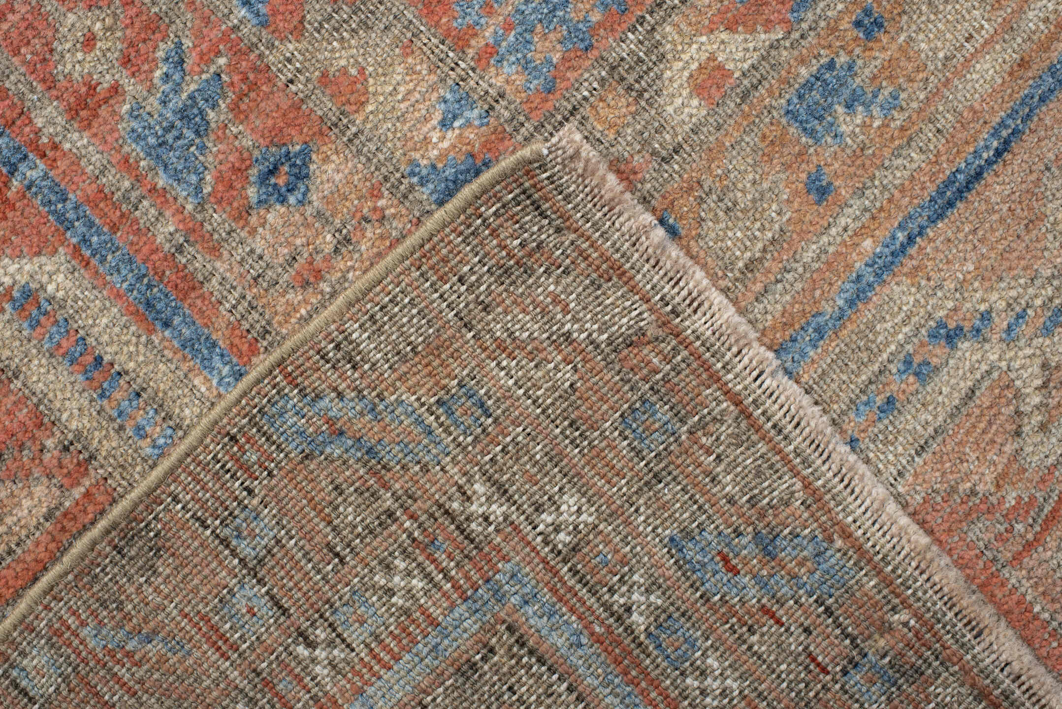 6' x 10' one-of-a-kind handmade antique Belouch large size rug. Color palette: rust, ivory, blue, terra cotta, camel, slate