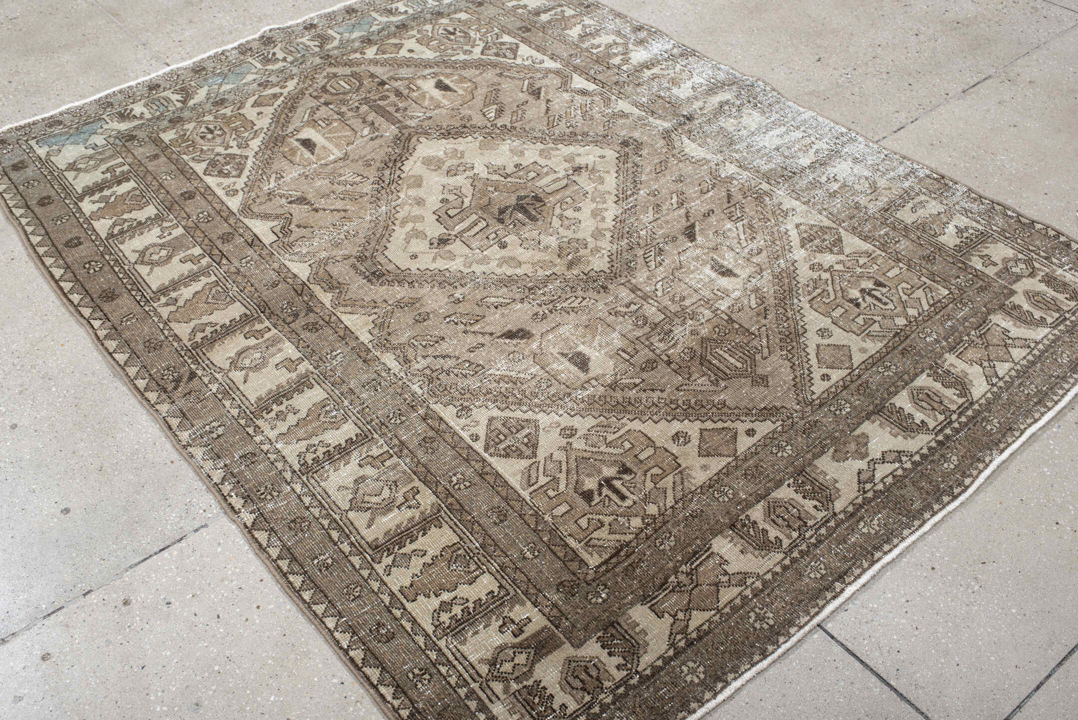 5' x 6' one-of-a-kind handmade vintage Sarab rug. Color palette: ivory, taupe, brown, camel, pale_blue, beige, gray