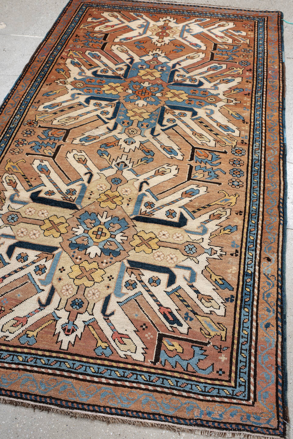 3' x 6' one-of-a-kind handmade vintage Kazak small size rug. Color palette: terra cotta, ivory, sky blue, navy, gold, brown