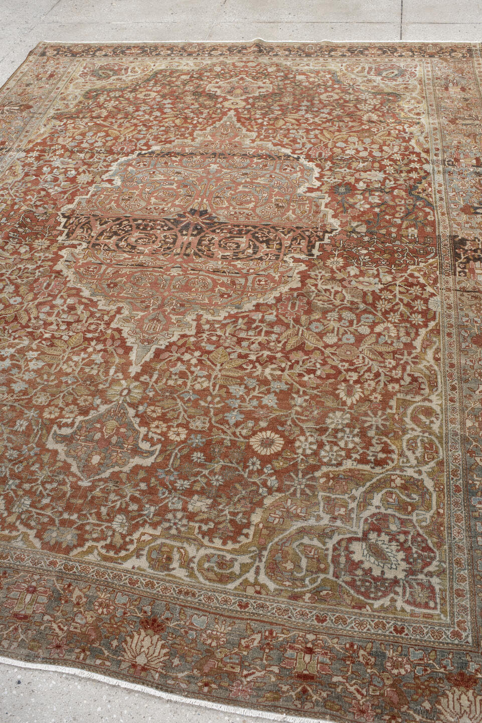 7' x 9' one-of-a-kind handmade antique Far.Sarouk rug. Color palette: rust, terracotta, ivory, slate, taupe, camel, charcoal