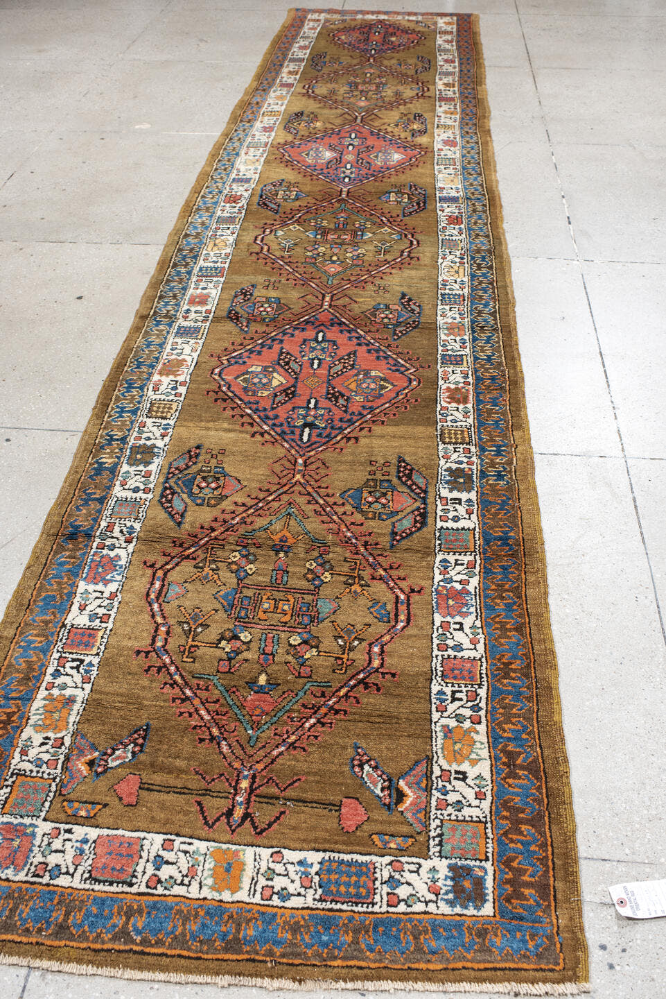 3' x 16' one-of-a-kind handmade vintage Sarab runner rug. Color palette: camel, rust, ivory, navy, terra cotta, indigo, rose