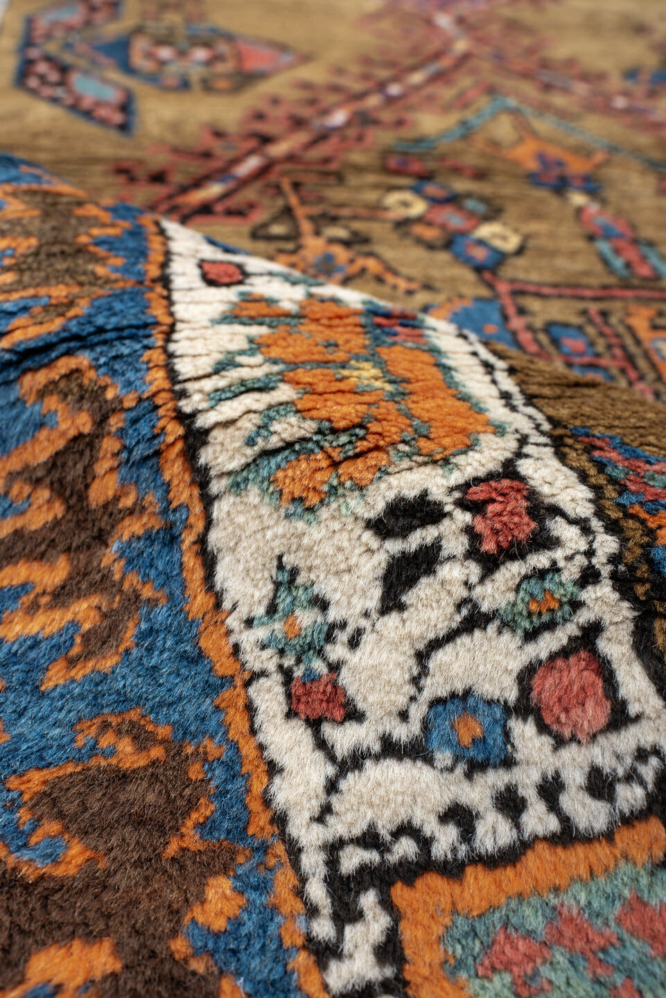 3' x 16' one-of-a-kind handmade vintage Sarab runner rug. Color palette: camel, rust, ivory, navy, terra cotta, indigo, rose