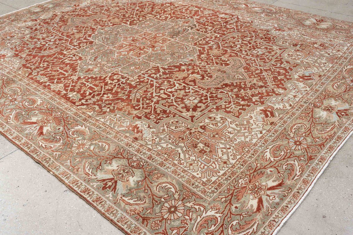 12' x 9' one-of-a-kind handmade vintage Heriz rug. Color palette: terracotta, ivory, pale blue, blue gray, camel, rust