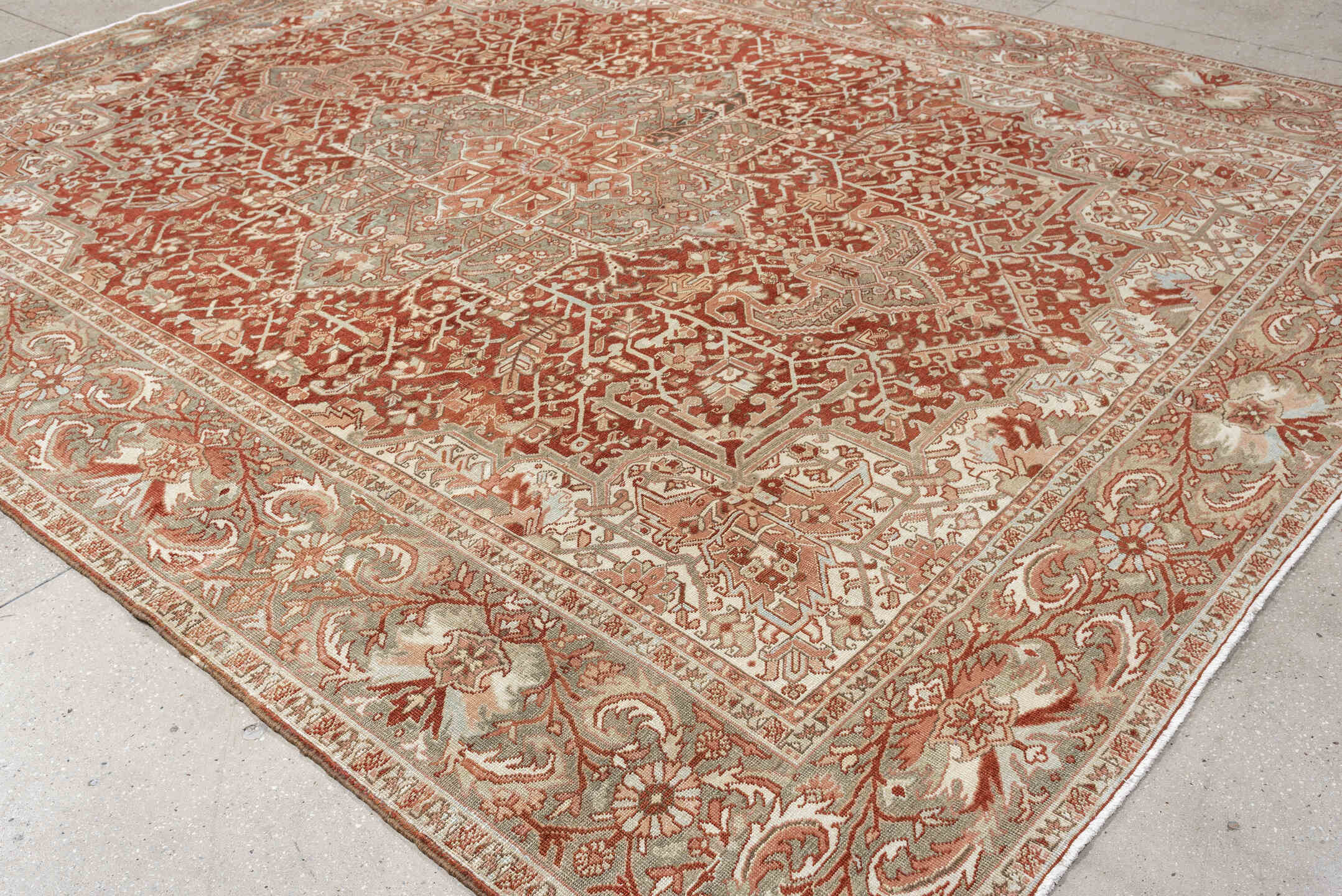 12' x 9' one-of-a-kind handmade vintage Heriz rug. Color palette: terracotta, ivory, pale blue, blue gray, camel, rust