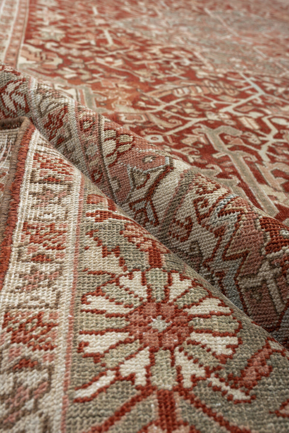 12' x 9' one-of-a-kind handmade vintage Heriz rug. Color palette: terracotta, ivory, pale blue, blue gray, camel, rust