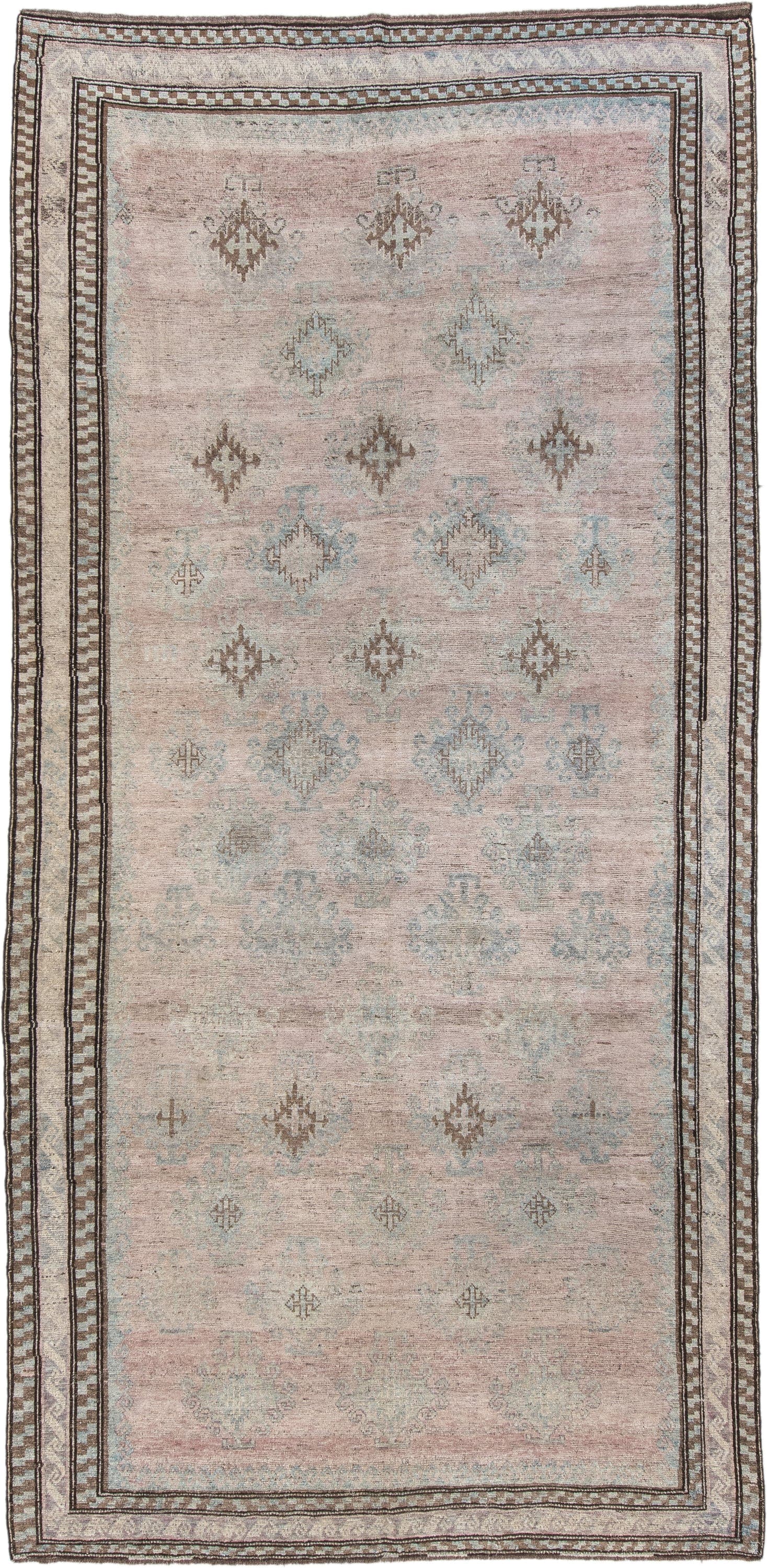 5' x 11' one-of-a-kind handmade vintage  rug. Color palette: blush, ivory, taupe, pale blue, brown, beige, pink, gray