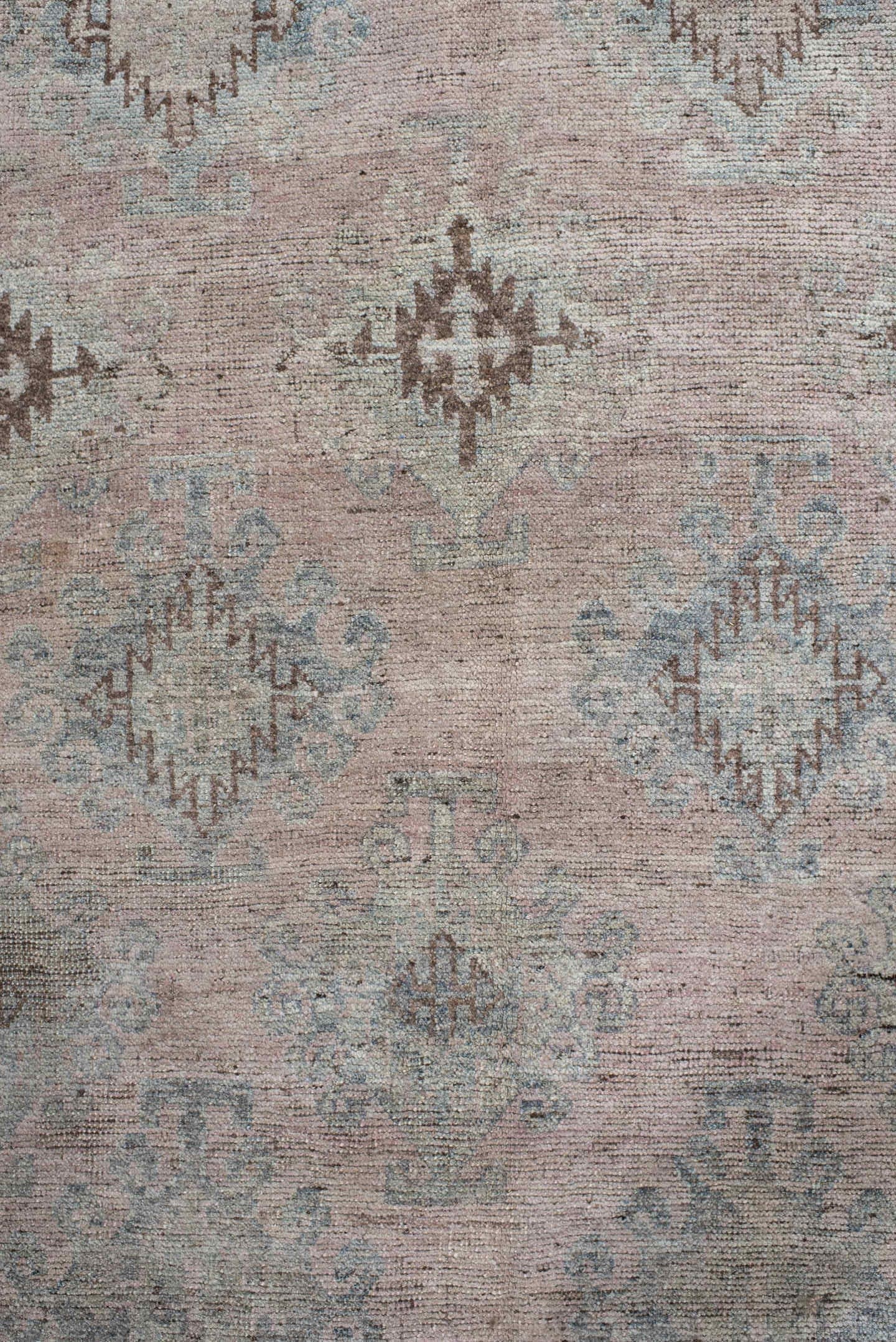 5' x 11' one-of-a-kind handmade vintage  rug. Color palette: blush, ivory, taupe, pale blue, brown, beige, pink, gray