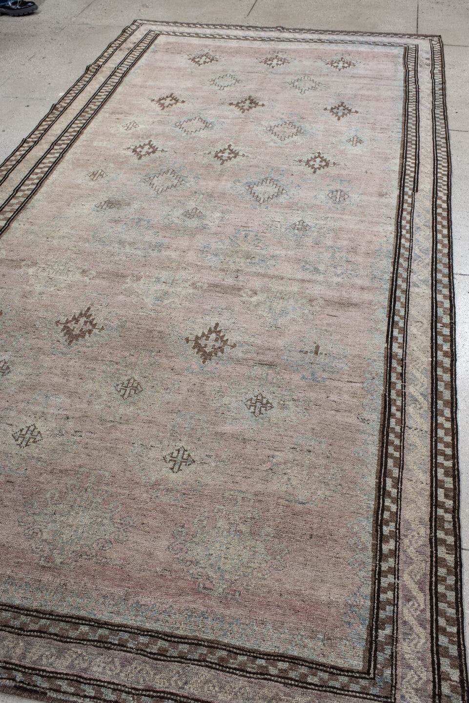5' x 11' one-of-a-kind handmade vintage  rug. Color palette: blush, ivory, taupe, pale blue, brown, beige, pink, gray