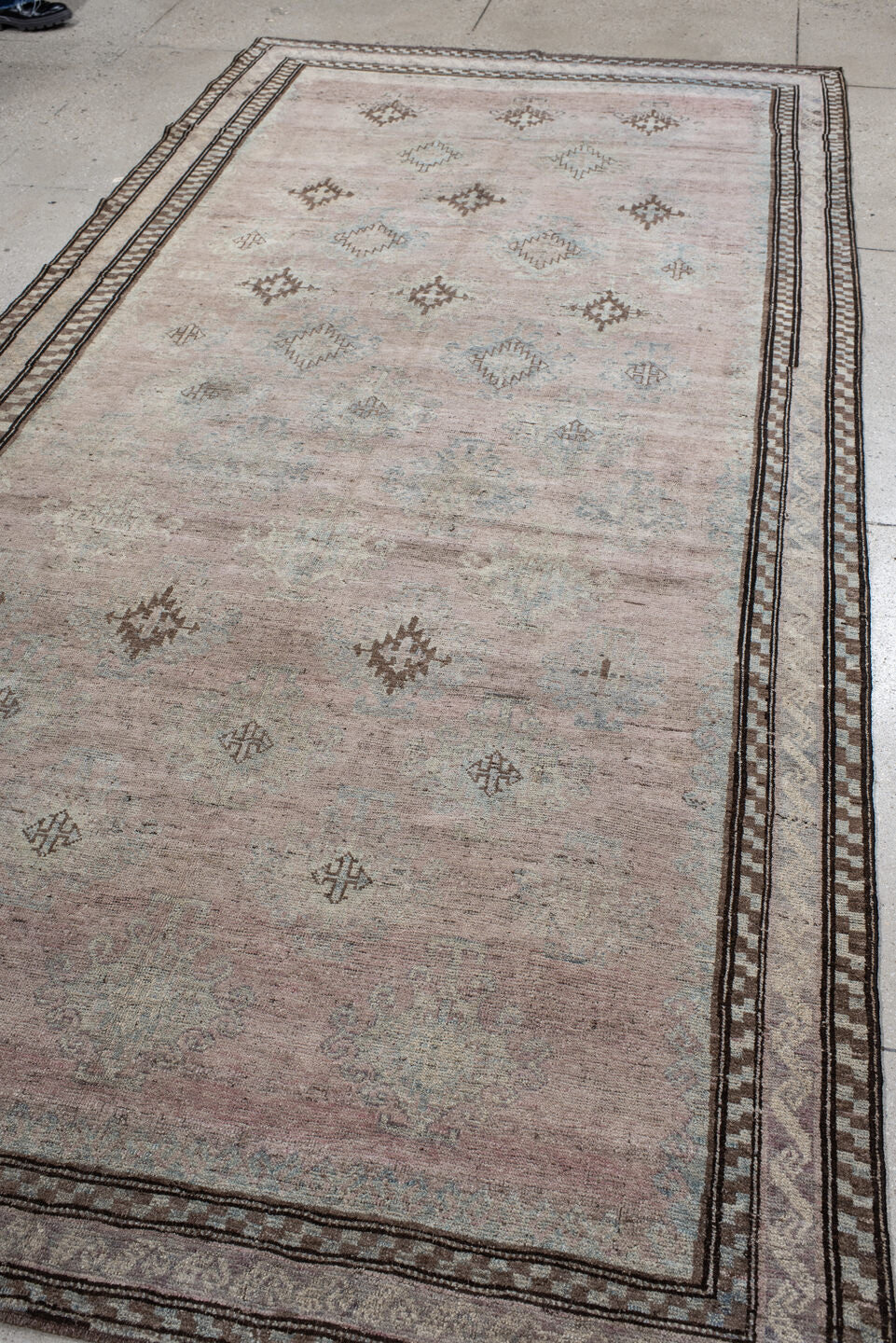 5' x 11' one-of-a-kind handmade vintage  rug. Color palette: blush, ivory, taupe, pale blue, brown, beige, pink, gray