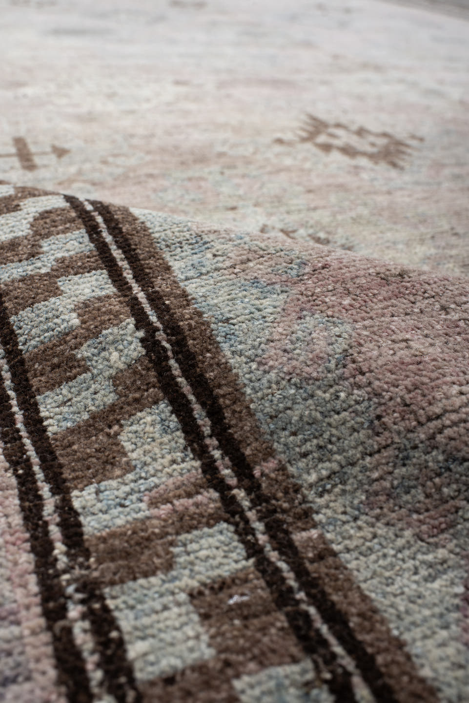 5' x 11' one-of-a-kind handmade vintage  rug. Color palette: blush, ivory, taupe, pale blue, brown, beige, pink, gray