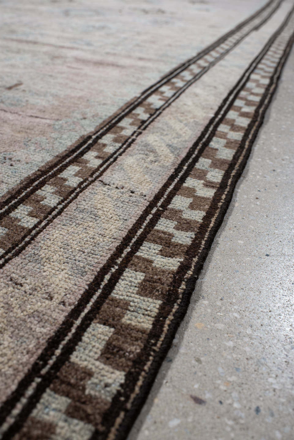 5' x 11' one-of-a-kind handmade vintage  rug. Color palette: blush, ivory, taupe, pale blue, brown, beige, pink, gray