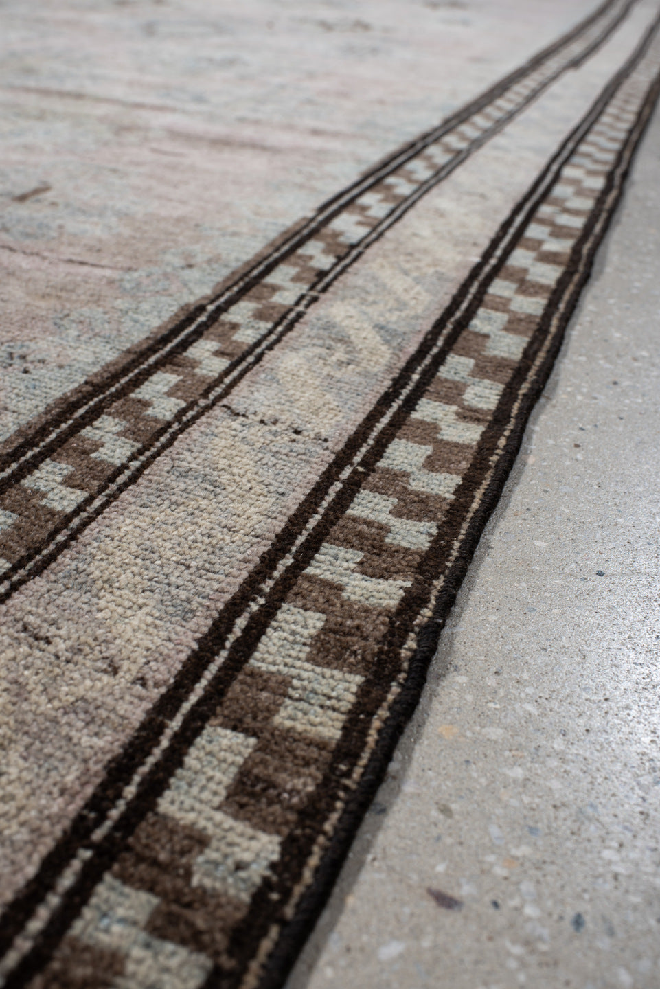 5' x 11' one-of-a-kind handmade vintage  rug. Color palette: blush, ivory, taupe, pale blue, brown, beige, pink, gray