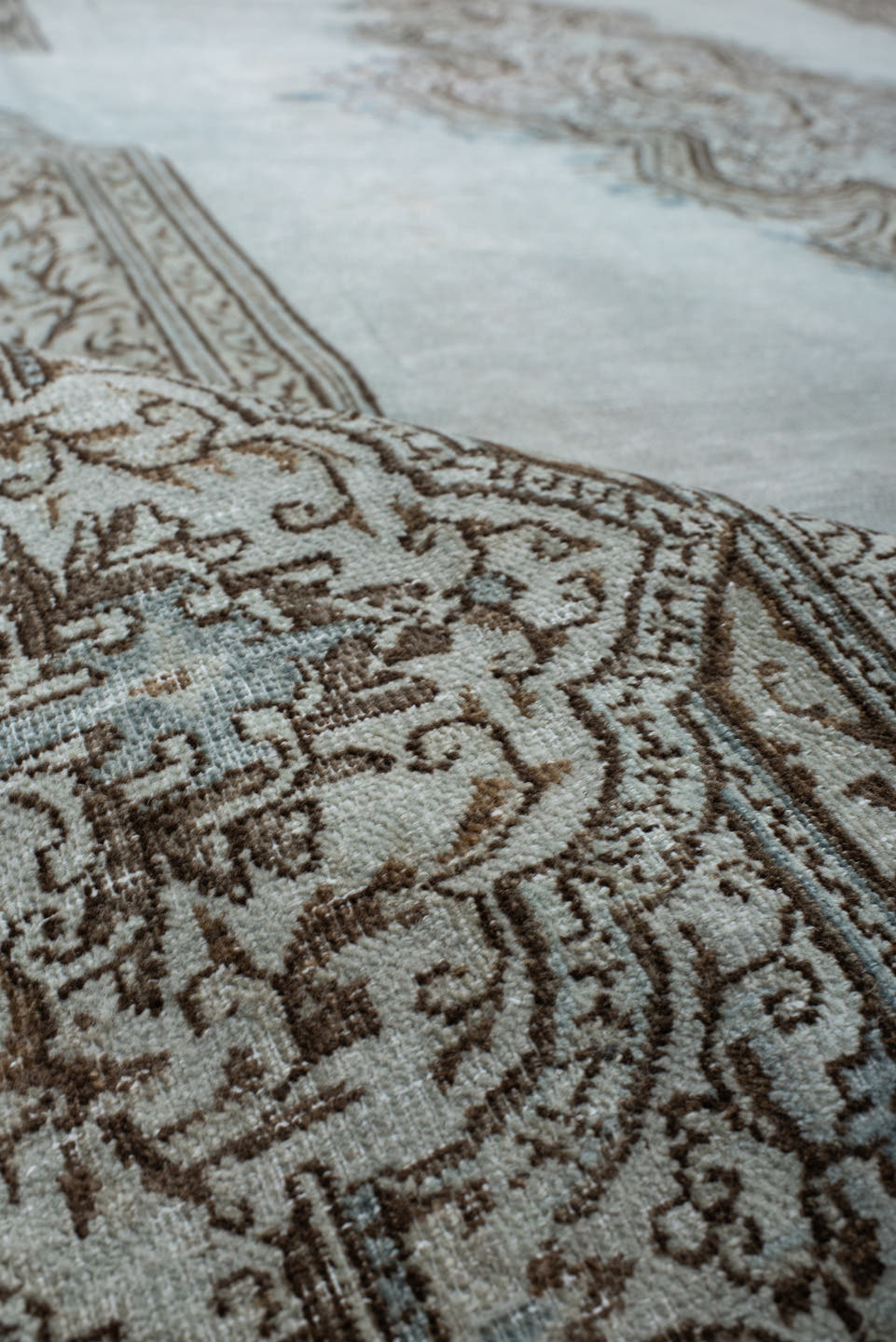 9' x 12' one-of-a-kind handmade vintage large size rug. Color palette: pale blue, ivory, taupe, brown, sky blue, light blue