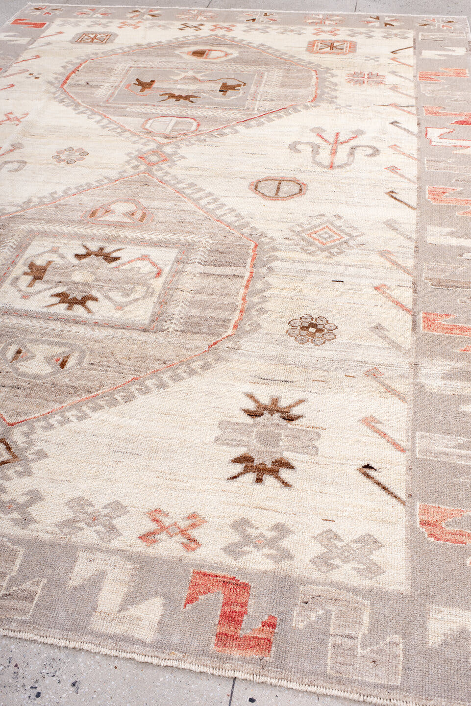 9' x 12' one-of-a-kind handmade vintage Kars large size rug. Color palette: ivory, taupe, light gray, coral, brown, beige