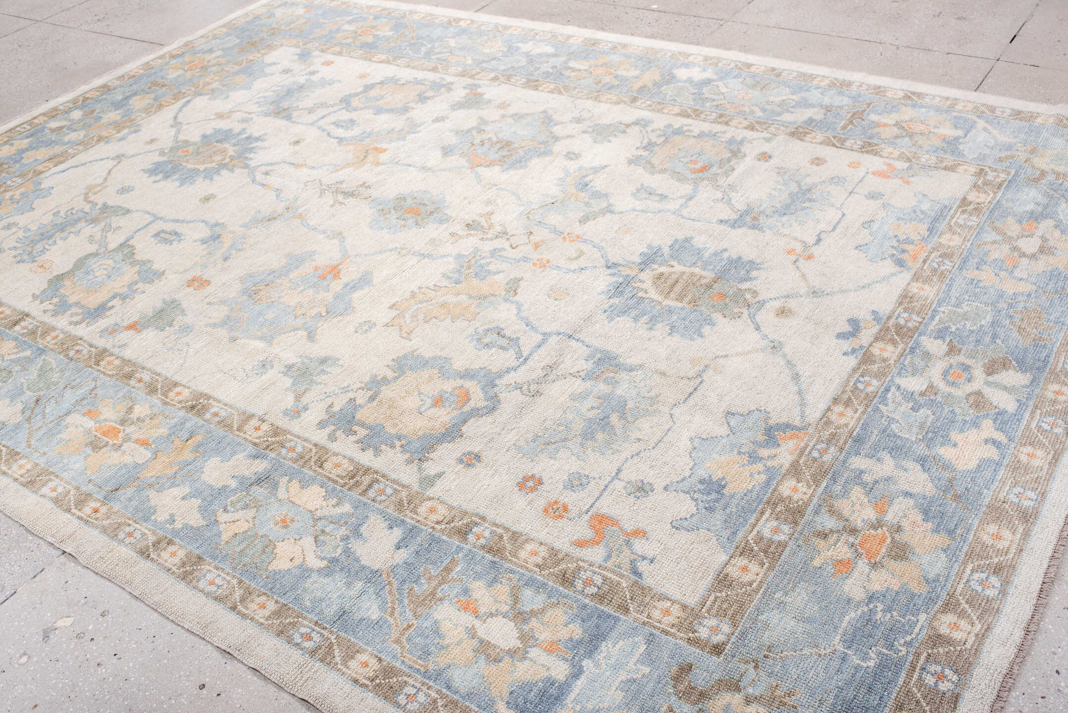 8' x 11' one-of-a-kind handmade vintage Oushak large size rug. Color palette: ivory, powder blue, taupe, soft peach, cream