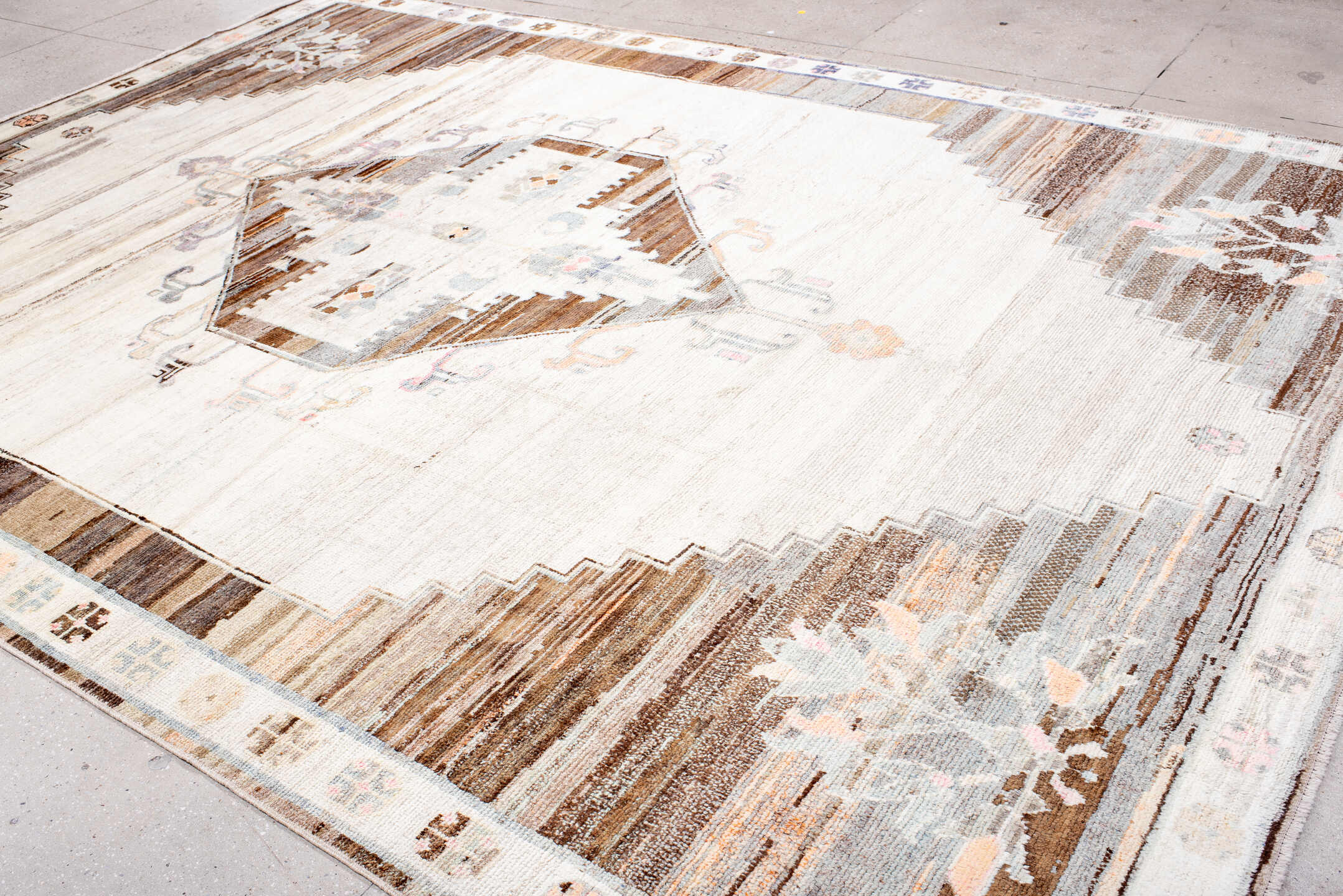 10' x 13' one-of-a-kind handmade vintage Kars large size rug. Color palette: ivory, brown, taupe, camel, pale blue, lavender