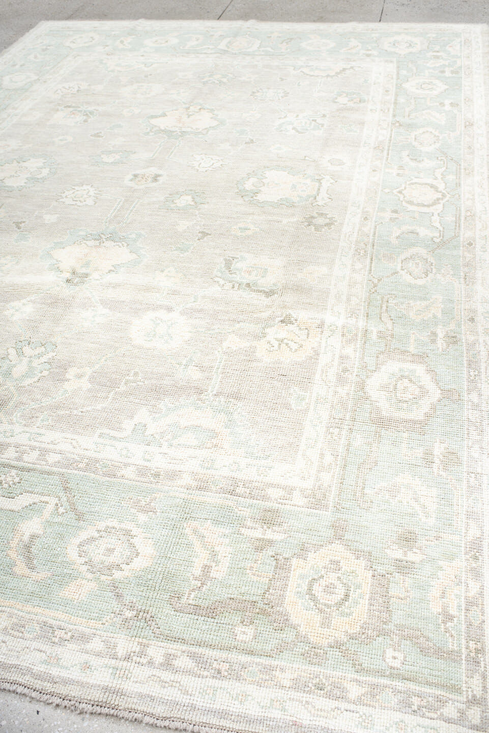 8' x 11' one-of-a-kind handmade vintage Oushak large size rug. Color palette: ivory, pale aqua, taupe, cream, sage, beige