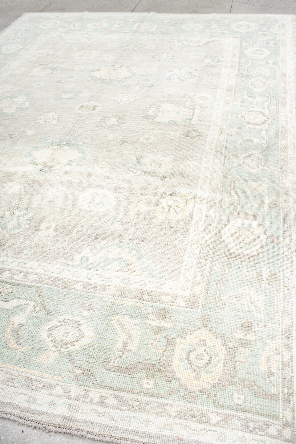 8' x 11' one-of-a-kind handmade vintage Oushak large size rug. Color palette: ivory, pale aqua, taupe, cream, sage, beige