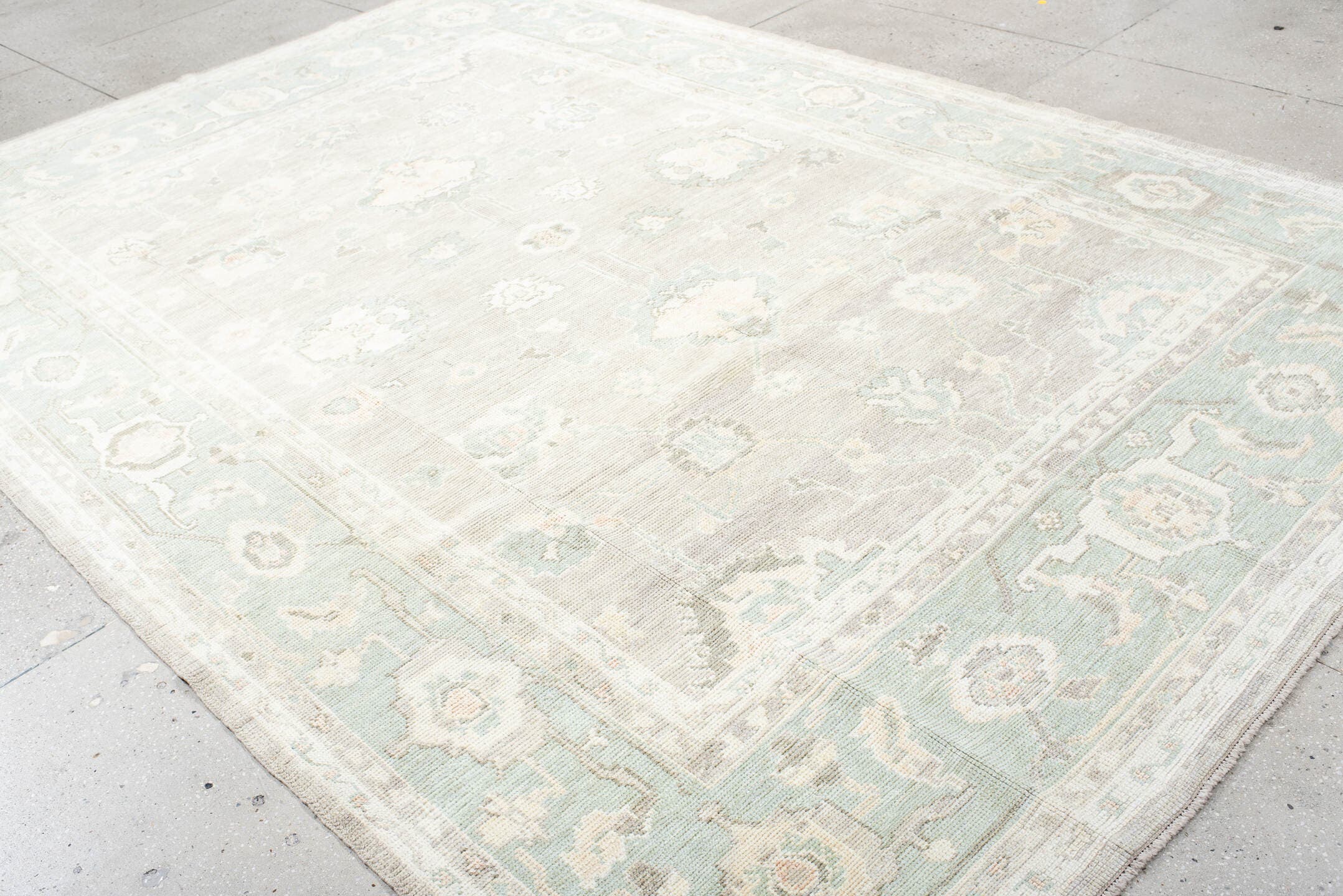 8' x 11' one-of-a-kind handmade vintage Oushak large size rug. Color palette: ivory, pale aqua, taupe, cream, sage, beige