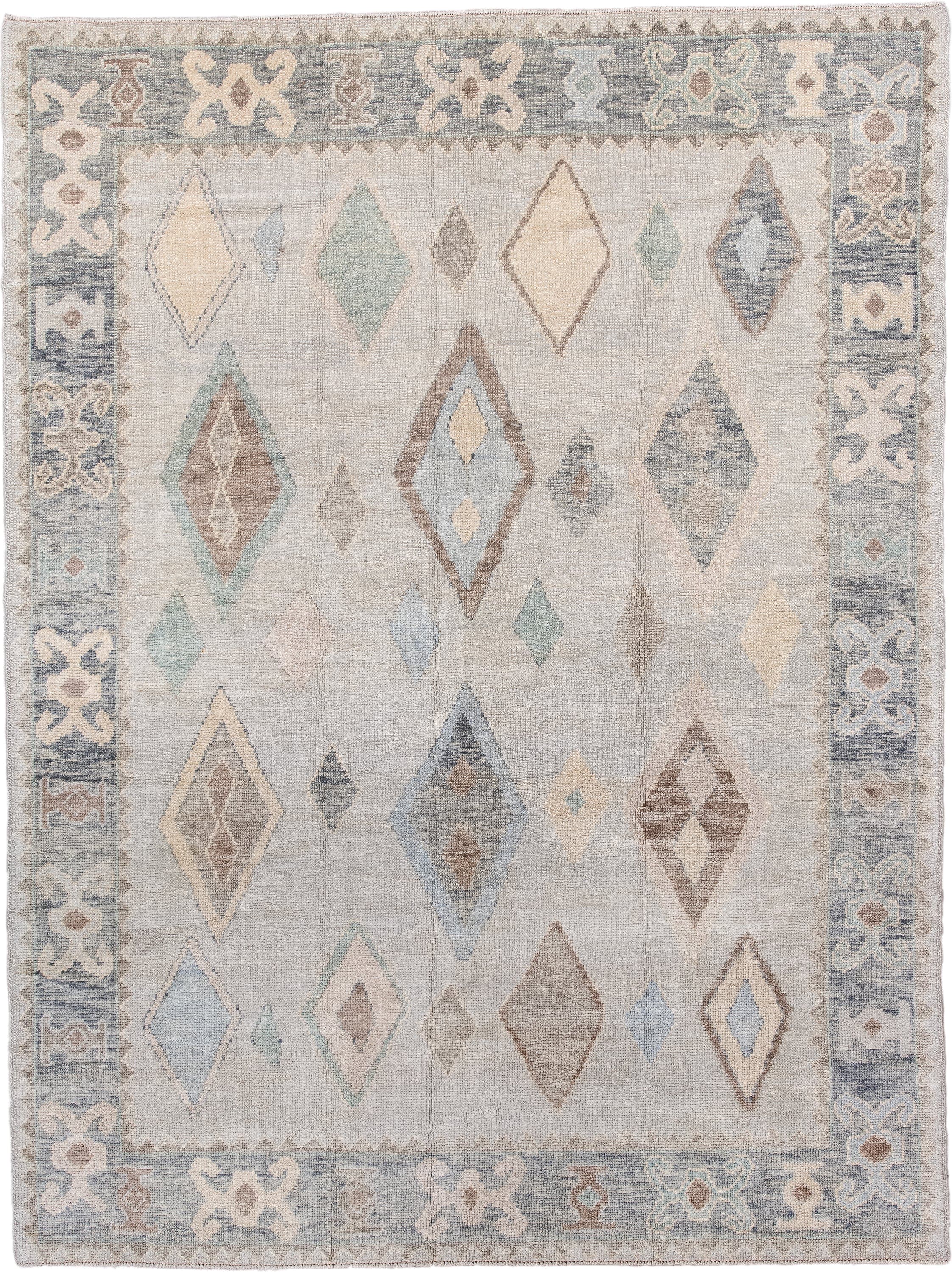 7' x 10' one-of-a-kind handmade vintage Oushak large size rug. Color palette: ivory, pale blue, taupe, cream, sage, camel
