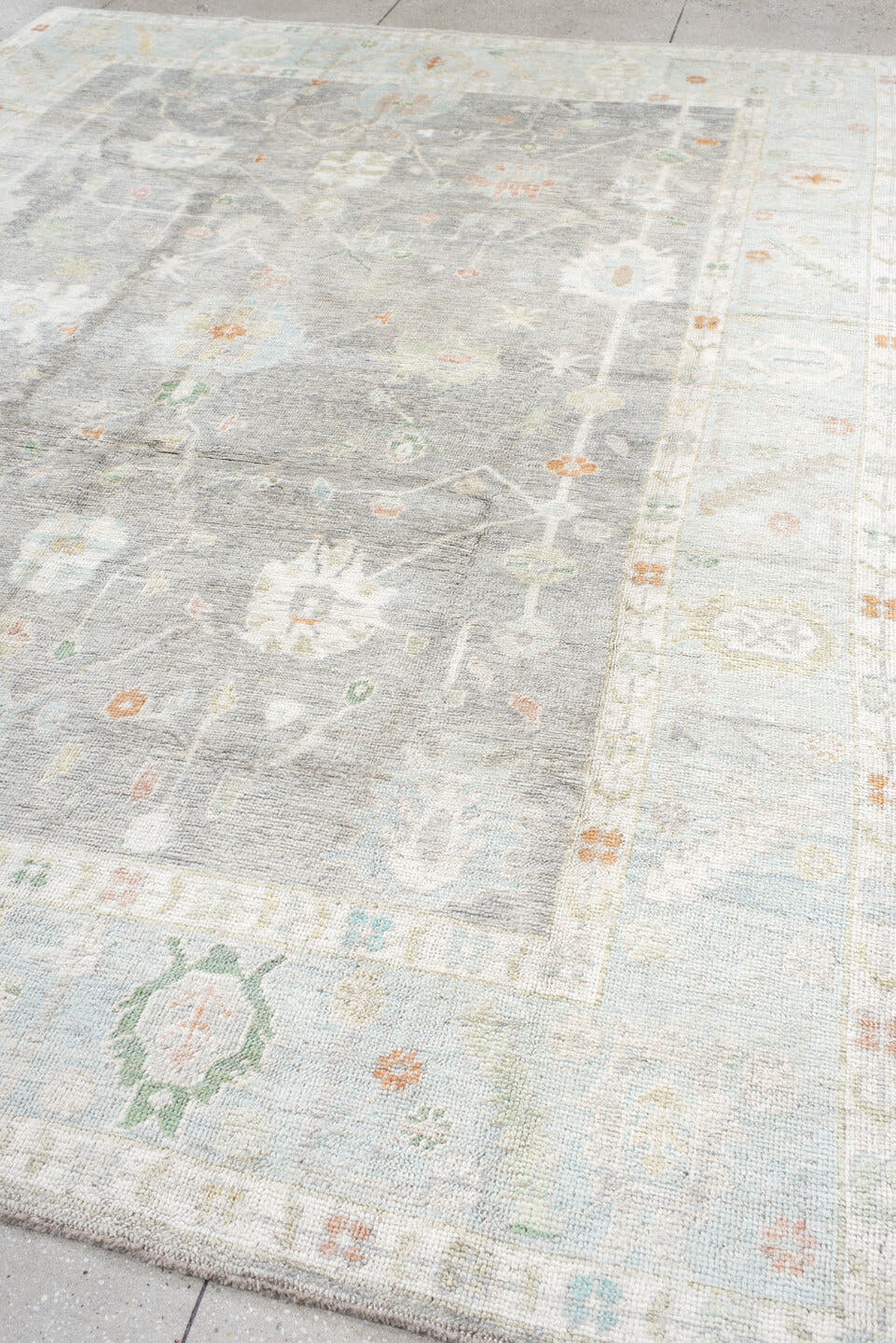 9' x 12' one-of-a-kind handmade vintage Oushak large size rug. Color palette: light gray, ivory, pale blue, sage, soft peach