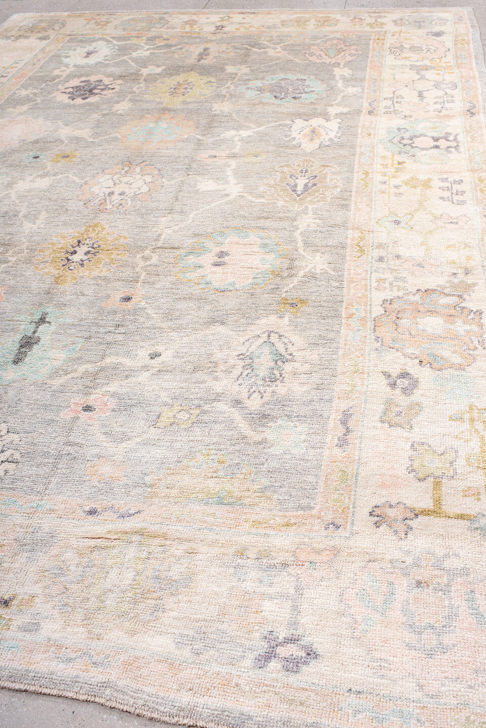 9' x 14' one-of-a-kind handmade vintage Oushak large size rug. Color palette: gray, ivory, blush, aqua, lavender, gold