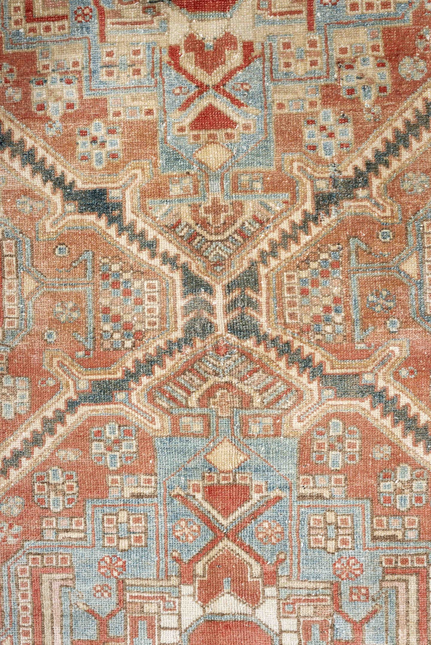 4' x 6' one-of-a-kind handmade antique Baktiary rug. Color palette: terra cotta, ivory, sky blue, slate, camel, rust