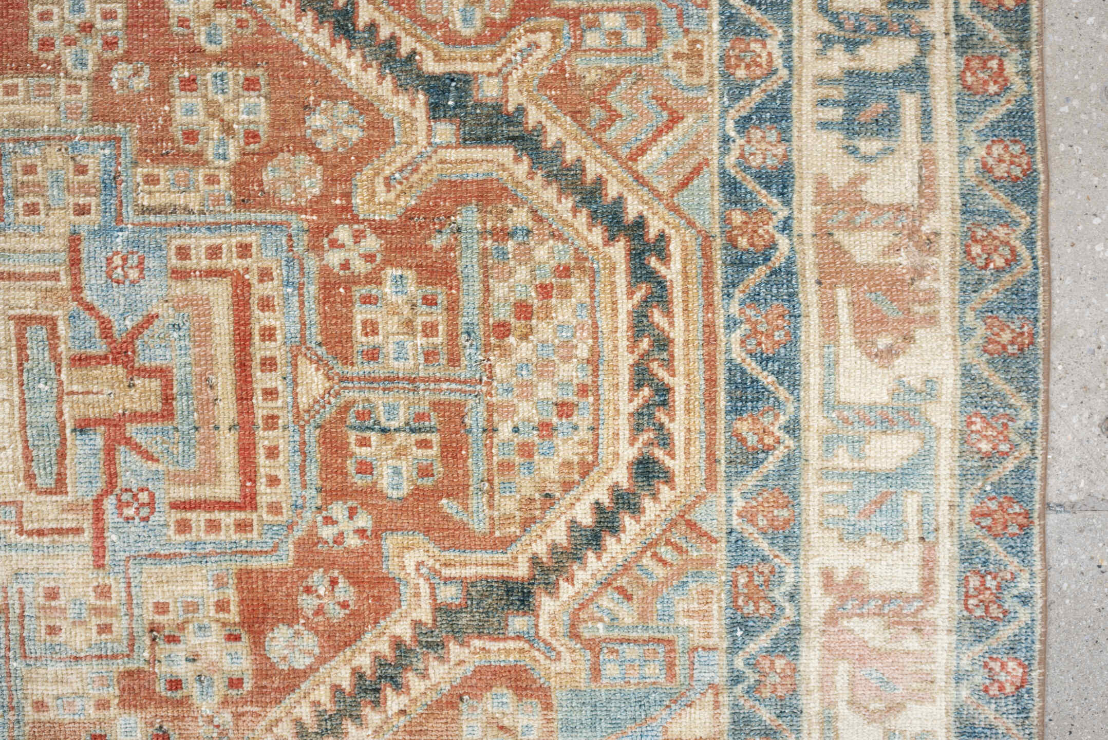 4' x 6' one-of-a-kind handmade antique Baktiary rug. Color palette: terra cotta, ivory, sky blue, slate, camel, rust