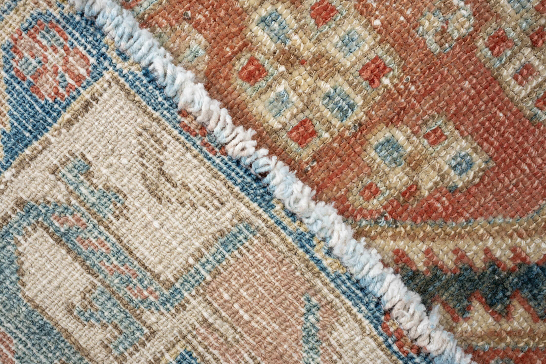4' x 6' one-of-a-kind handmade antique Baktiary rug. Color palette: terra cotta, ivory, sky blue, slate, camel, rust