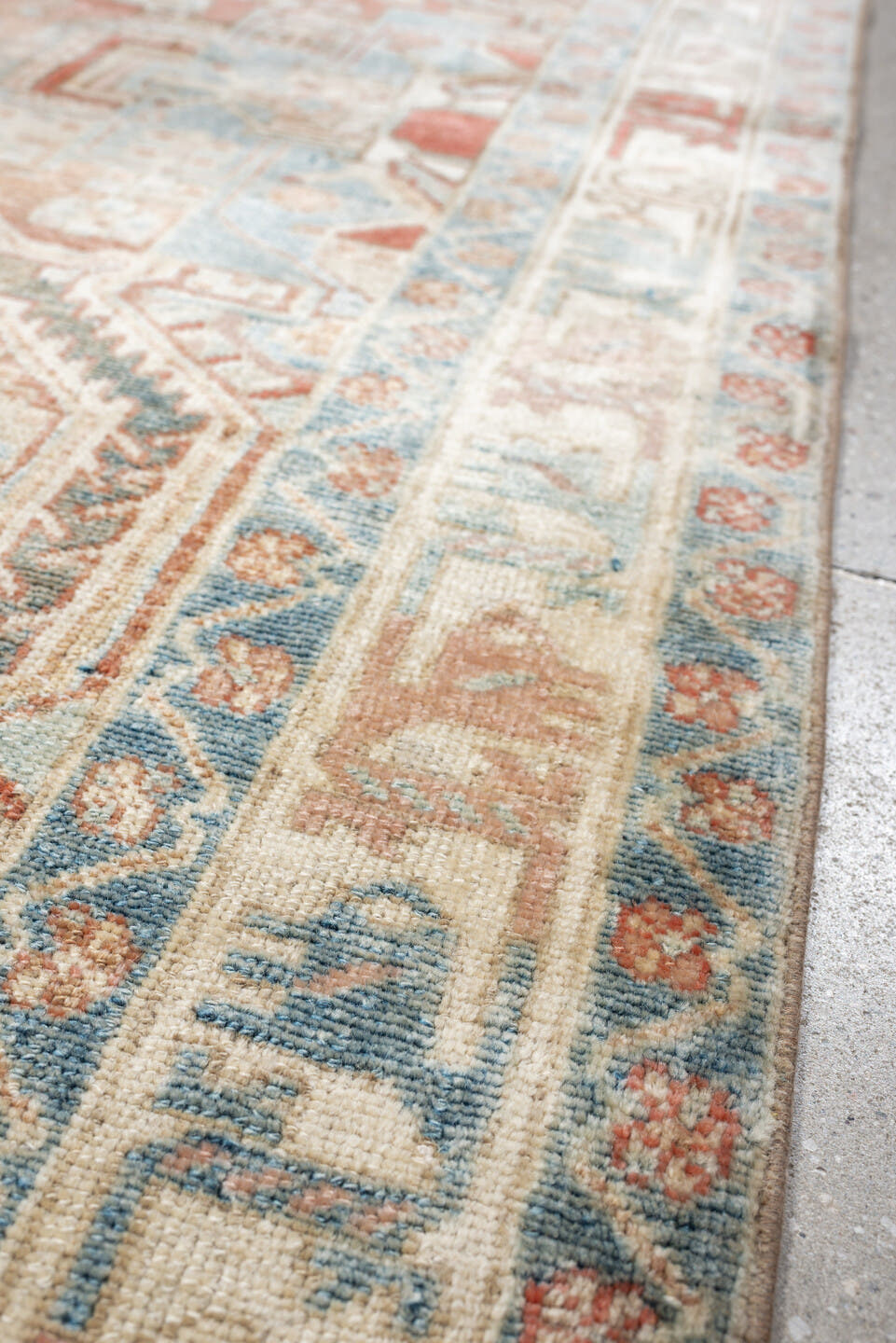 4' x 6' one-of-a-kind handmade antique Baktiary rug. Color palette: terra cotta, ivory, sky blue, slate, camel, rust