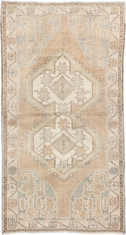 3' x 6' one-of-a-kind handmade vintage Kurd runner rug. Color palette: camel, ivory, pale blue, taupe, sand, light brown