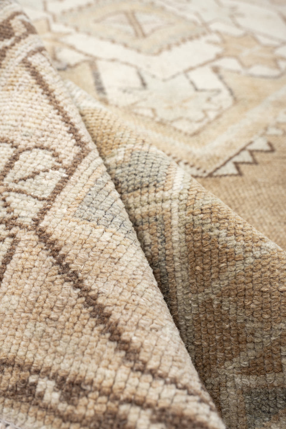 3' x 6' one-of-a-kind handmade vintage Kurd runner rug. Color palette: camel, ivory, pale blue, taupe, sand, light brown